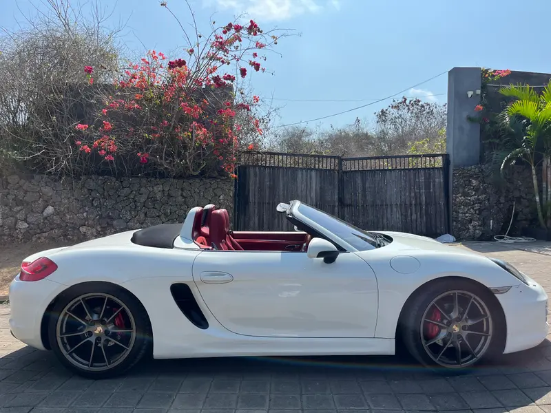 Porsche Boxster White (Black Soft Top), side