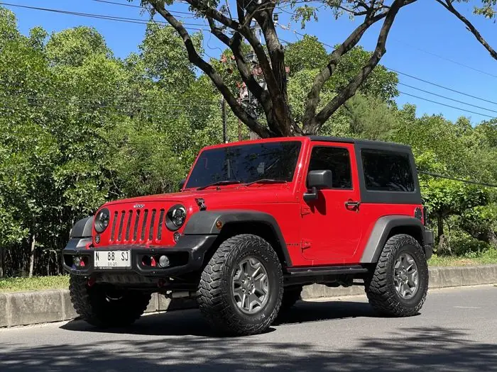 A red Jeep Wrangler two-door in Bali