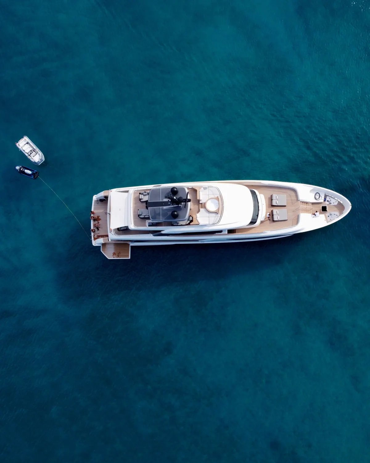 A motor yacht on deep blue sea, seen from above