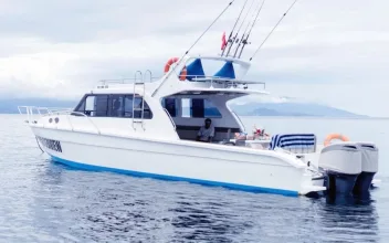 A white motor yacht on open water