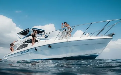 A white motor yacht cruising on blue water